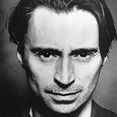 Robert Carlyle as TOBIN, THE EX-PRIEST