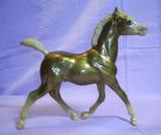 Breyer Running Foal Glossy Gold Charm is in your collection!