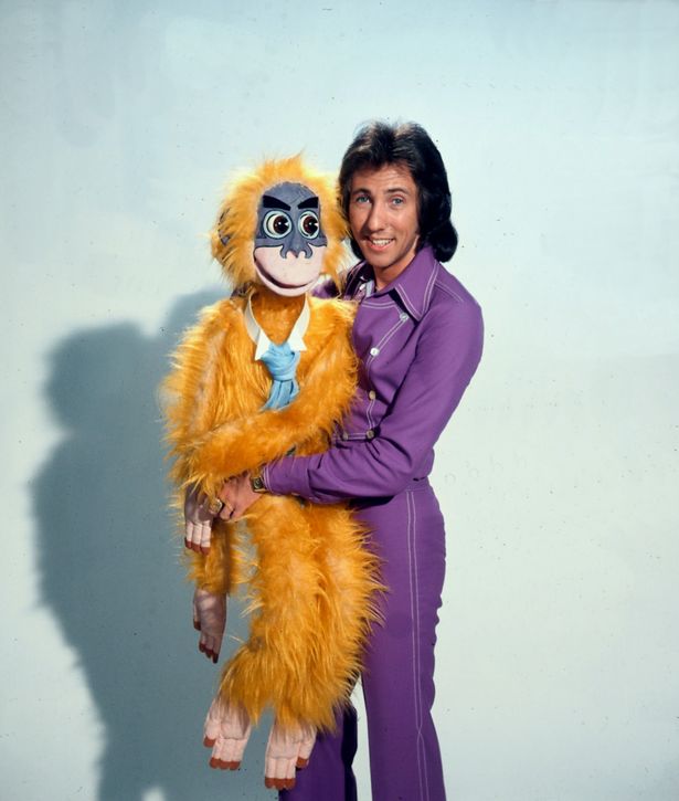 cuddles the monkey