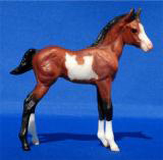 Breyer Classic Mustang Foal bay pinto is in your collection!